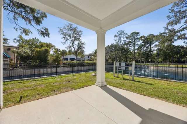 an aerial view of residential houses with outdoor space and swimming pool