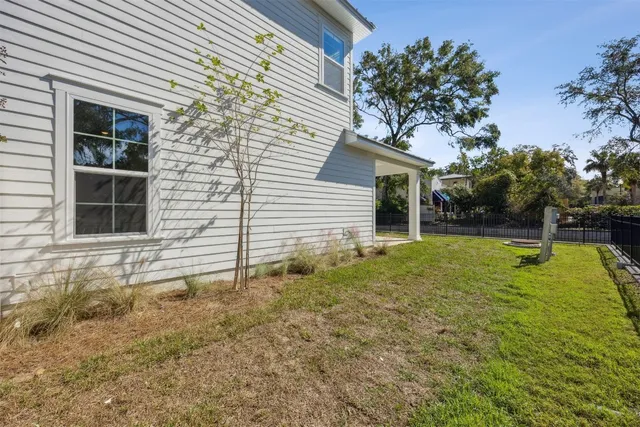 an aerial view of a residential houses with outdoor space