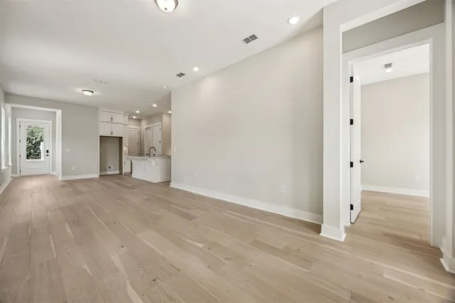 a kitchen with stainless steel appliances granite countertop a stove and a refrigerator