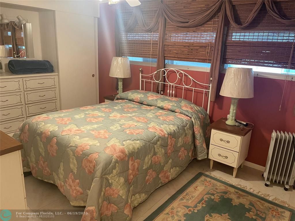 1888 Southwest 85th Avenue Davie, FL 33324 - Photo 13 of 18 a bedroom with a bed and a dresser next to a window