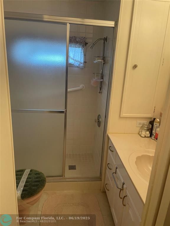 1888 Southwest 85th Avenue Davie, FL 33324 - Photo 16 of 18 a bathroom with a sink and shower