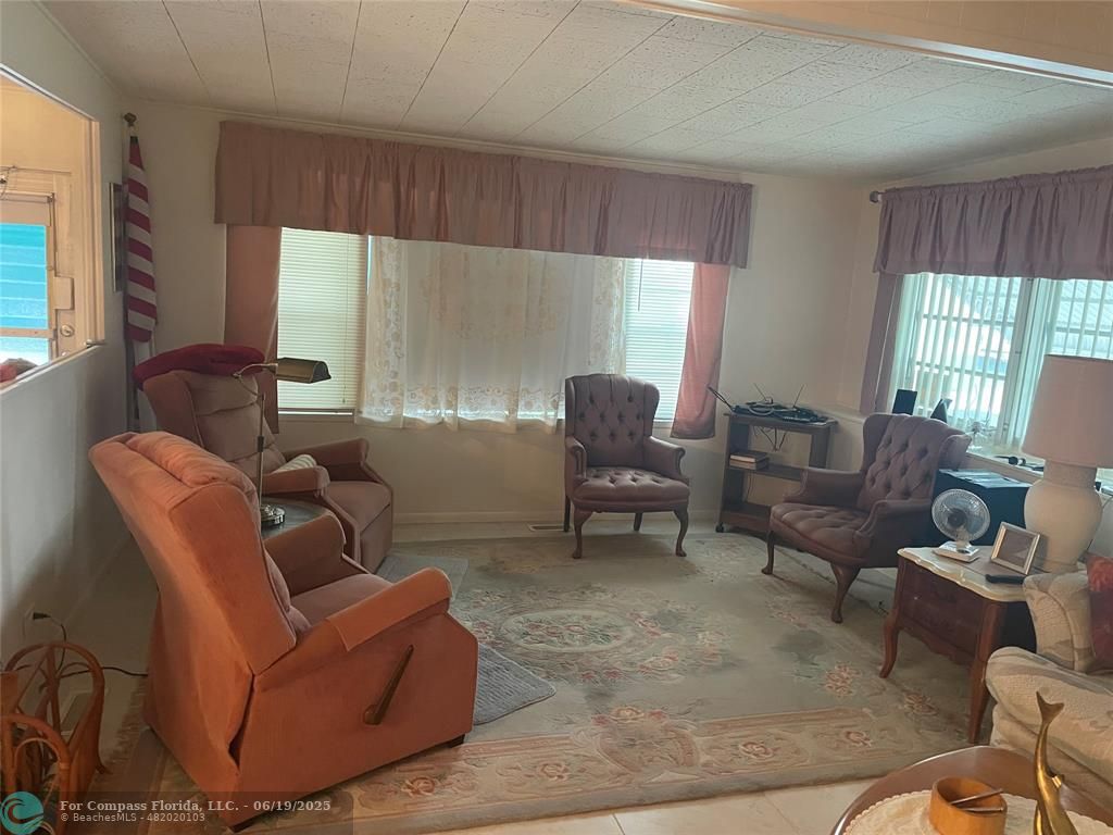 1888 Southwest 85th Avenue Davie, FL 33324 - Photo 3 of 18 a living room with furniture and a large window