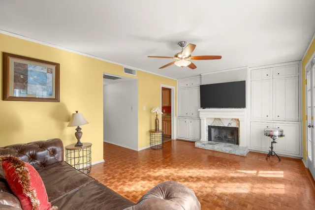 a bedroom with a bed couch and table