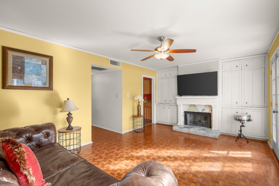6631 Valleyside Road Austin, TX 78731 - Photo 17 of 33 a bedroom with a bed and a flat screen tv