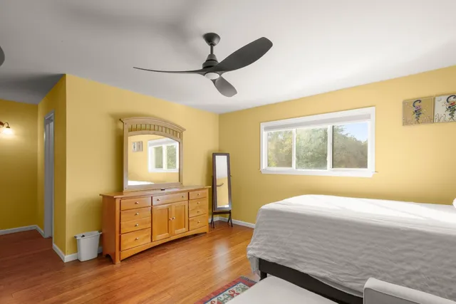 a bedroom with furniture and a window