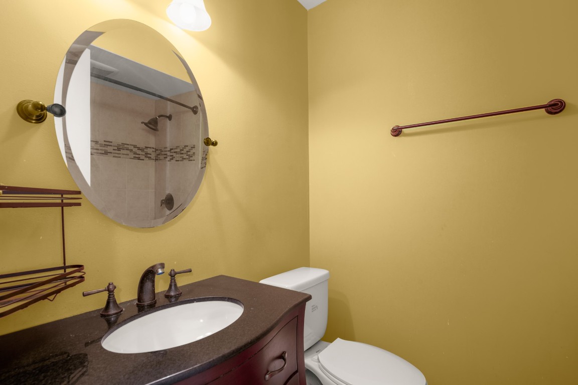 6631 Valleyside Road Austin, TX 78731 - Photo 22 of 33 a bathroom with a sink and a mirror