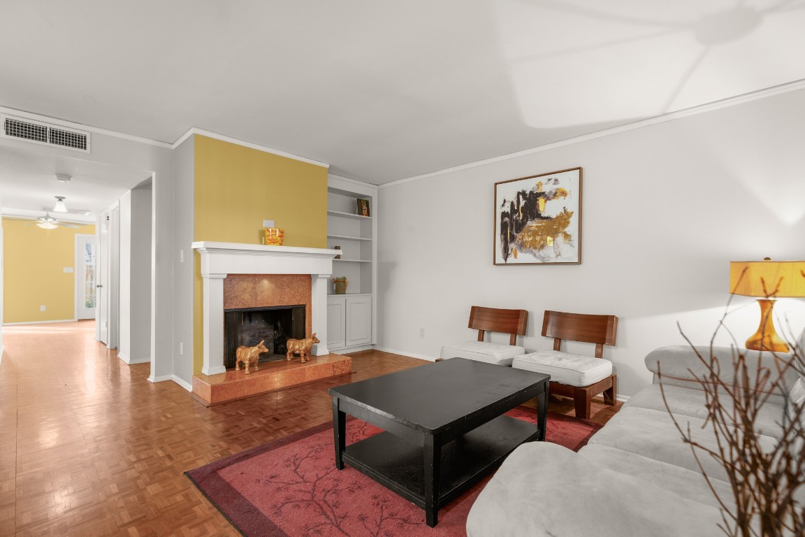 6631 Valleyside Road Austin, TX 78731 - Photo 9 of 33 a living room with furniture and a fireplace