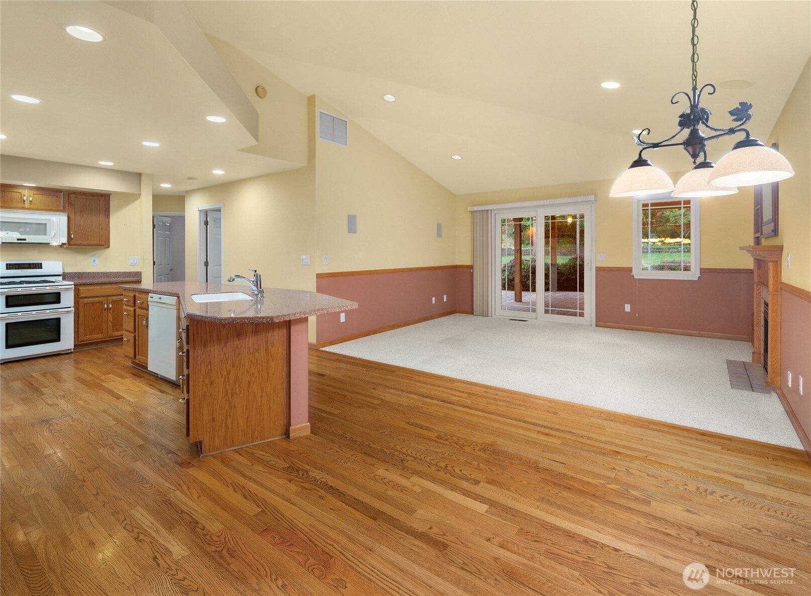 18663 Cascade Ridge Court Mount Vernon, WA 98274 - Photo 16 of 33 a large kitchen with stainless steel appliances granite countertop a sink a stove top oven a counter space and cabinets