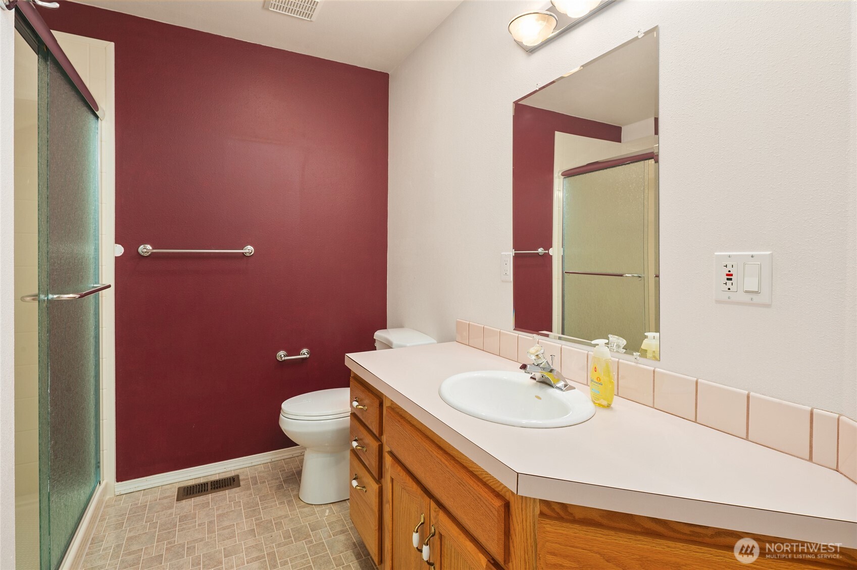 18663 Cascade Ridge Court Mount Vernon, WA 98274 - Photo 30 of 33 a bathroom with a sink vanity mirror and toilet