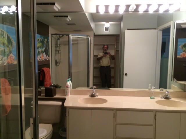 2461 Village Boulevard, Unit 101 West Palm Beach, FL 33409 - Photo 3 of 10 a bathroom with a sink and a mirror