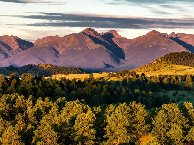 a view of a room with gym equipment and floor to ceiling windows