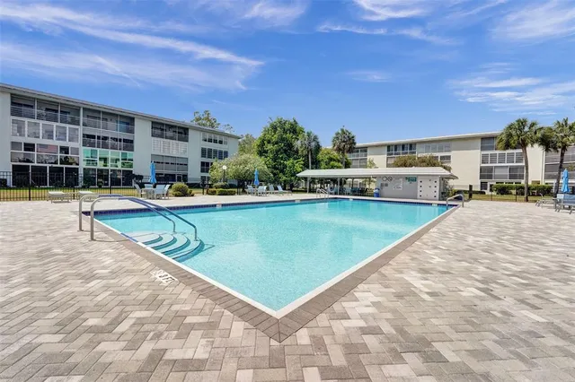 a view of a swimming pool is sitting in the middle of a building