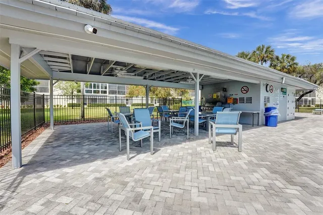a view of a chairs and table in patio of a house