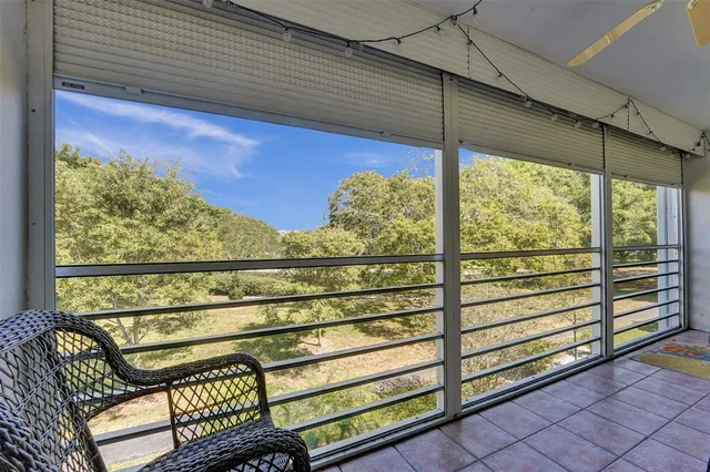 a view of a two chairs in the balcony