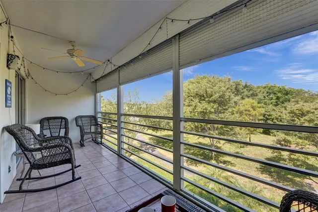 a view of a floor to ceiling window with a table