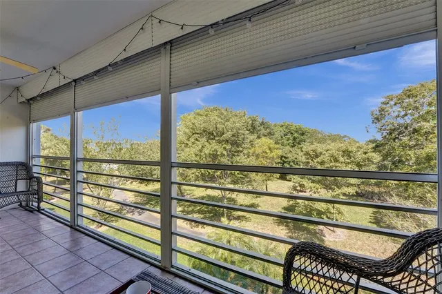 a view of a two chairs in the balcony