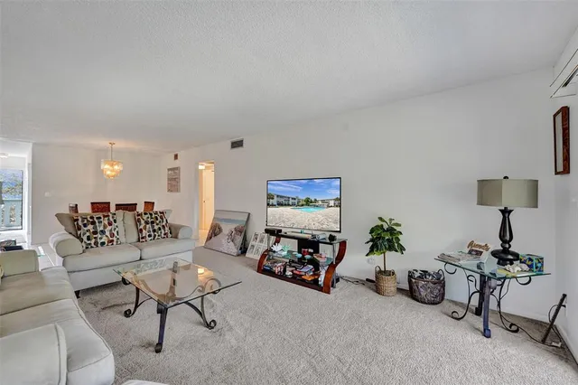 a living room with furniture and a lamp