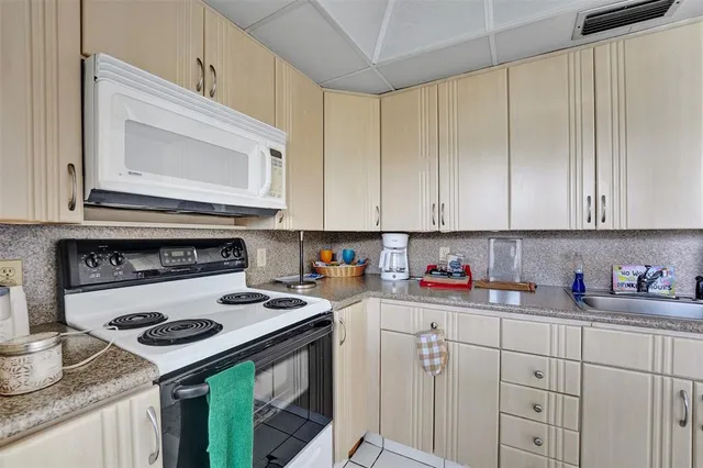 a dining room with furniture and a window