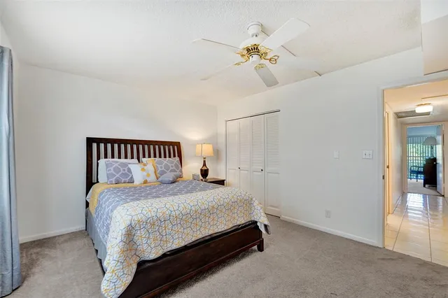 a bedroom with a bed and chandelier
