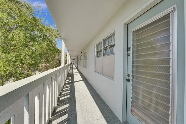 a view of balcony with wooden floor and stairs