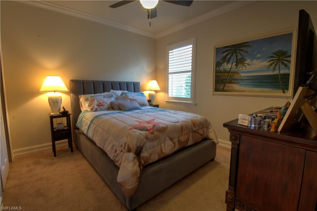 8472 Benelli Court Naples, FL 34114 - Photo 15 of 45 a bedroom with a bed and window