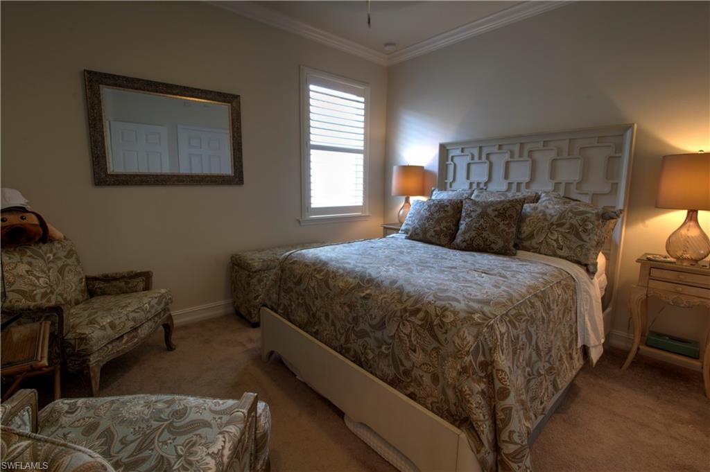 8472 Benelli Court Naples, FL 34114 - Photo 17 of 45 a bedroom with a bed and window