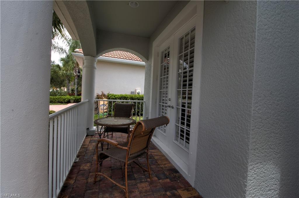 8472 Benelli Court Naples, FL 34114 - Photo 23 of 45 a view of a hallway with seating area
