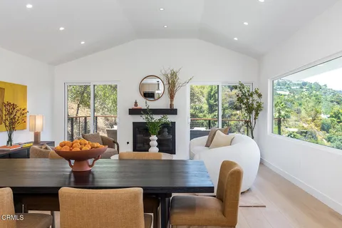 a view of a dining room with furniture window and outside view