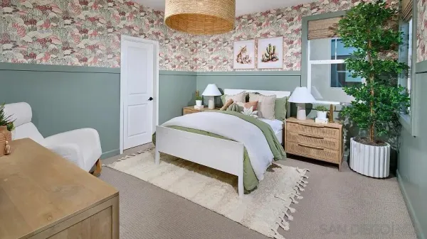 a bedroom with a bed and a couch