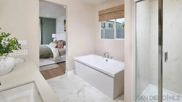 a en suite bathroom with a sink and mirror