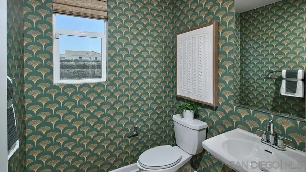 a bathroom with a toilet and a sink