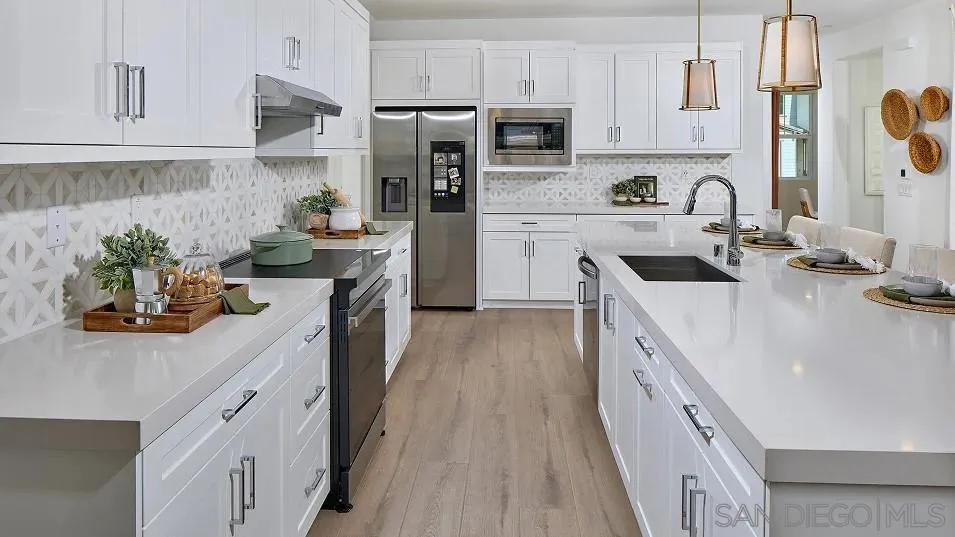 110 Takamasa Way Oceanside, CA 92057 - Photo 3 of 19 a kitchen with stainless steel appliances a sink stove refrigerator and cabinets