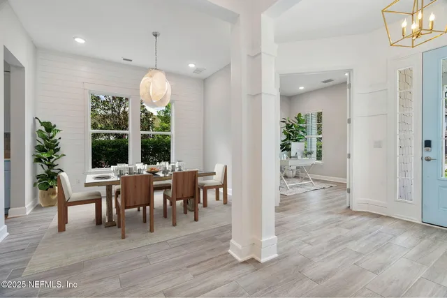 a view of a hallway view with wooden floor and staircase