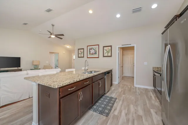 a kitchen with a sink and refrigerator