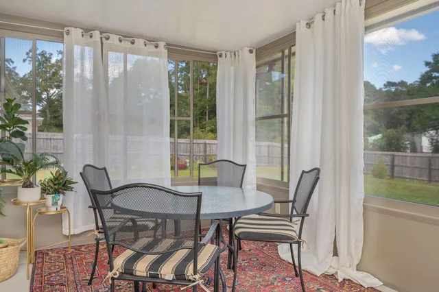 a view of a dining room with furniture window and outside view