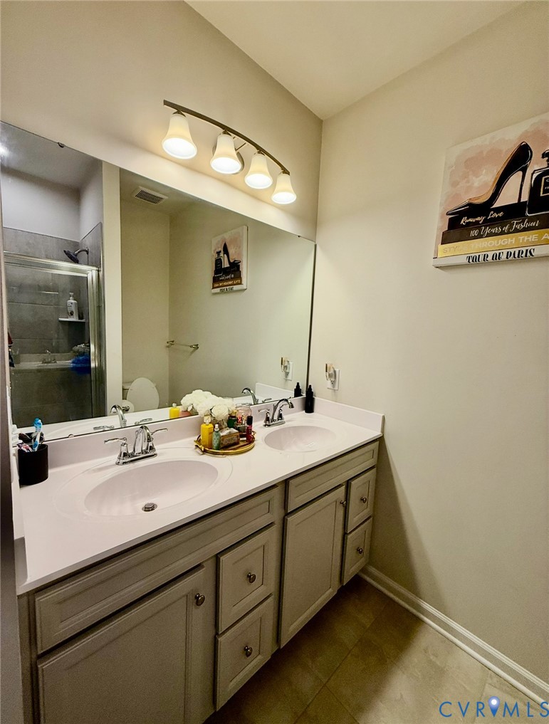 2007 Turtle Parkway Sandston, VA 23150 - Photo 12 of 20 a bathroom with a double vanity sink and mirror