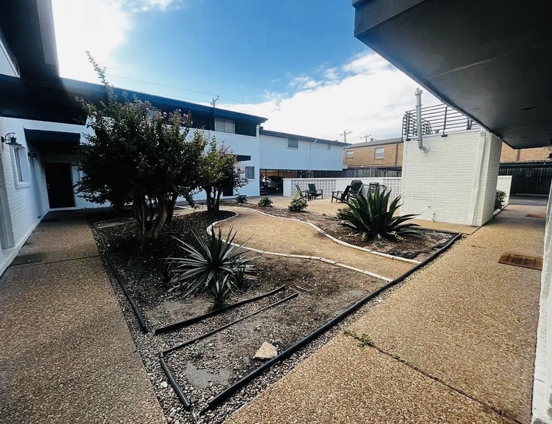 5123 Del Monte Drive, Unit 2 Houston, TX 77056 - Photo 1 of 12 a view of a chairs and potted plant