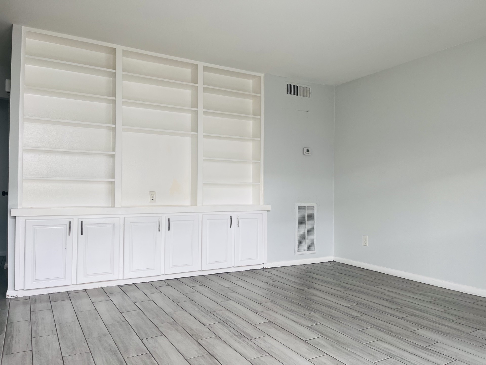 5123 Del Monte Drive, Unit 2 Houston, TX 77056 - Photo 3 of 12 a view of an empty room with wooden floor