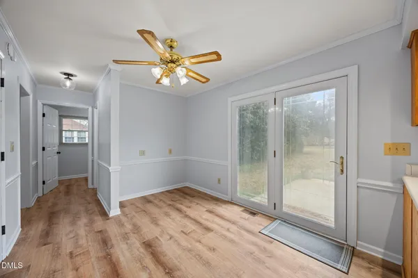 a large kitchen with kitchen island a sink stainless steel appliances and cabinets