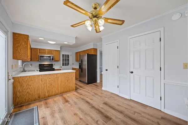 a room with a window and a wooden floor