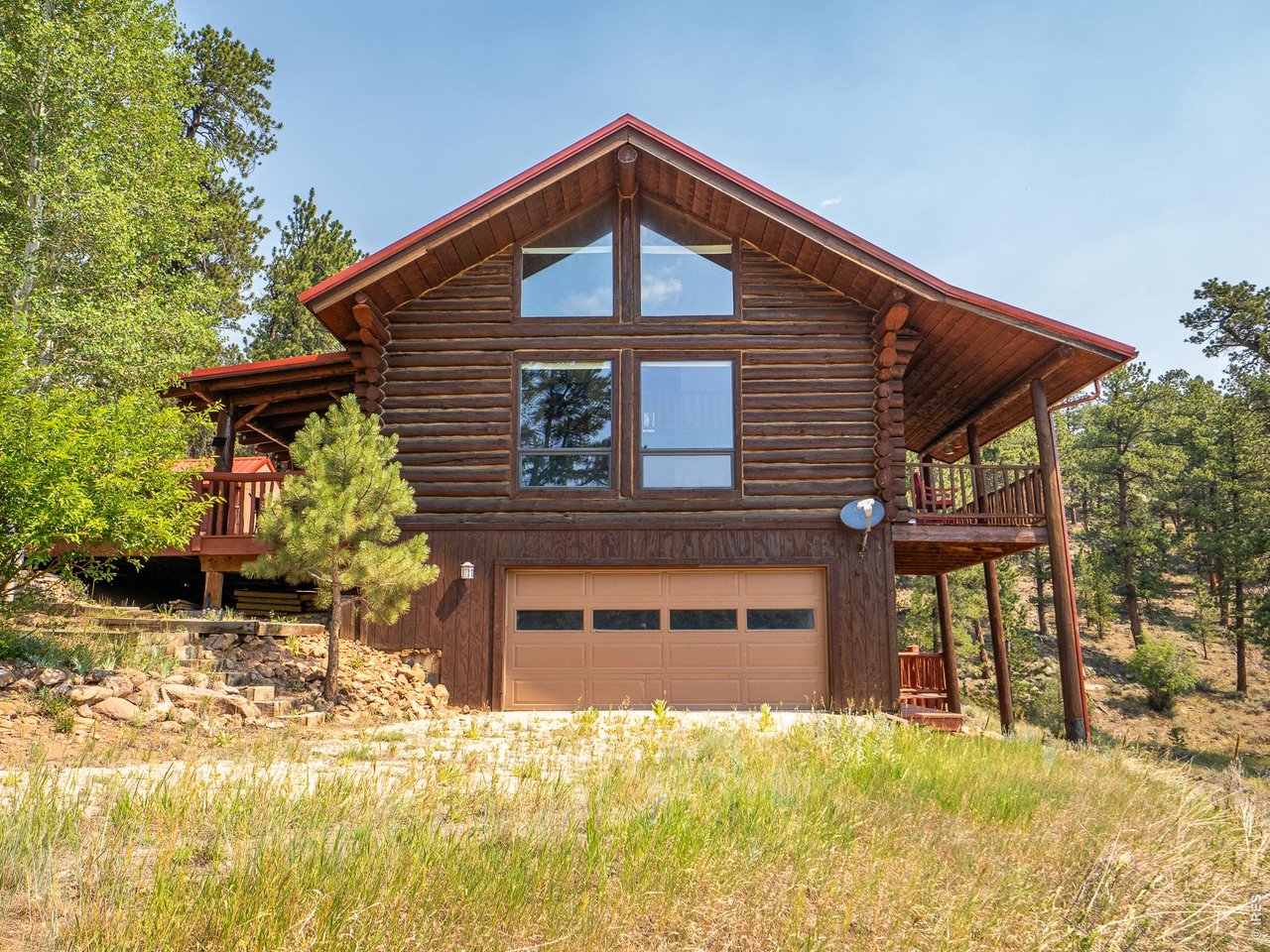 296 Caddo Road Red Feather Lakes, CO 80545 - Photo 28 of 50 Two-car garage entrance.