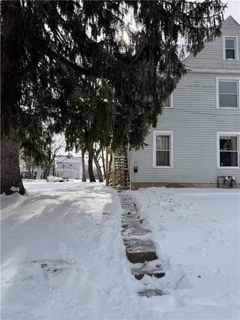 a view of a house with a tree