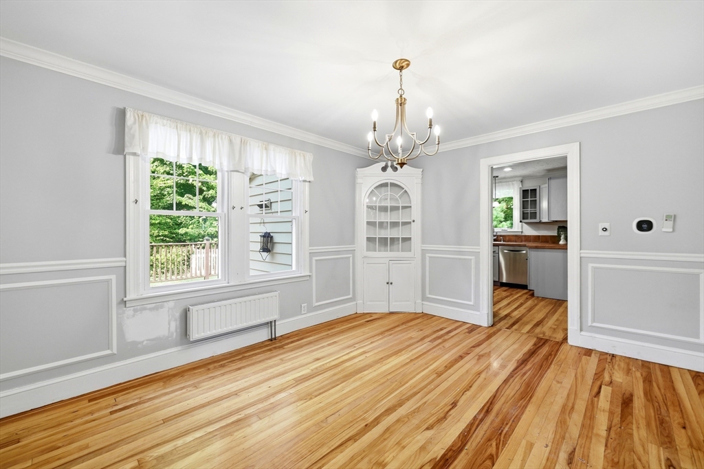 32 Lincoln Road Longmeadow, MA 01106 - Photo 14 of 36 a bedroom with a bed and a chandelier