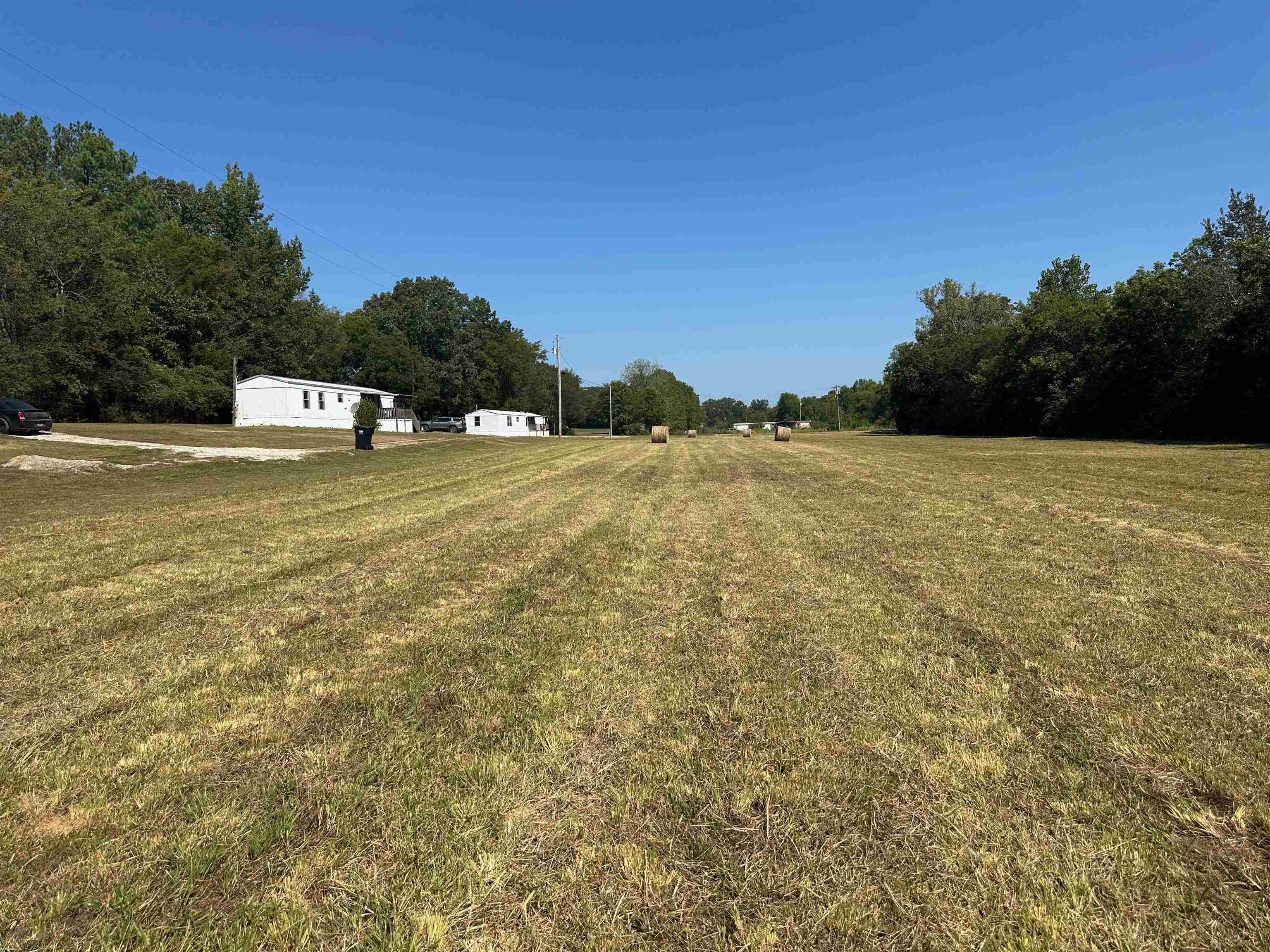 0 Henderson Road Sardis, TN 38371 - Photo 1 of 21 a house with pool in front of it