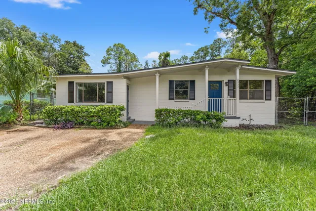 front view of a house with a yard