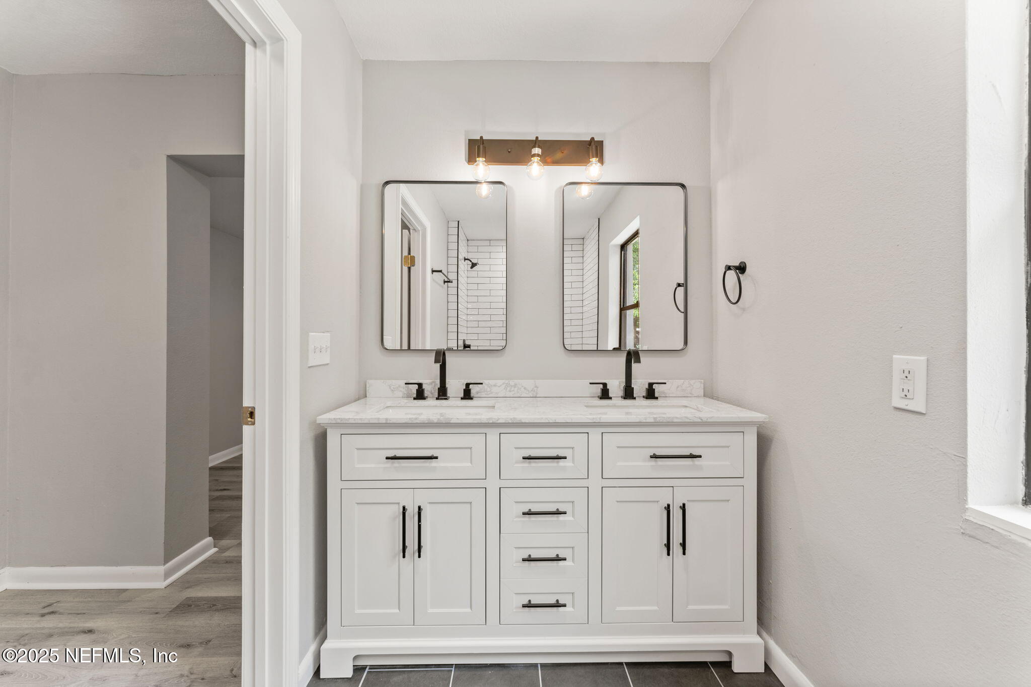 4924 Vermont Road Jacksonville, FL 32209 - Photo 10 of 19 a bathroom with a double vanity sink and a mirror