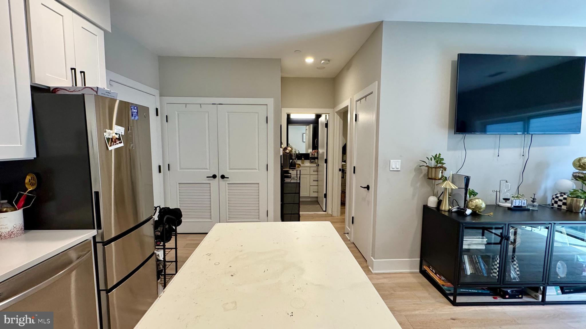 1016 17th Place Northeast, Unit 301 Washington, DC 20002 - Photo 3 of 12 a view of a kitchen from the hallway