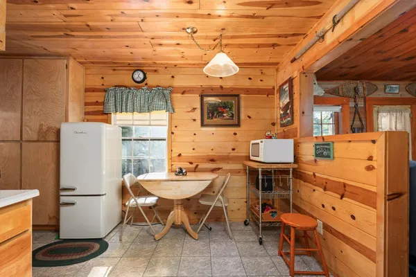 a large kitchen with a sink and cabinets