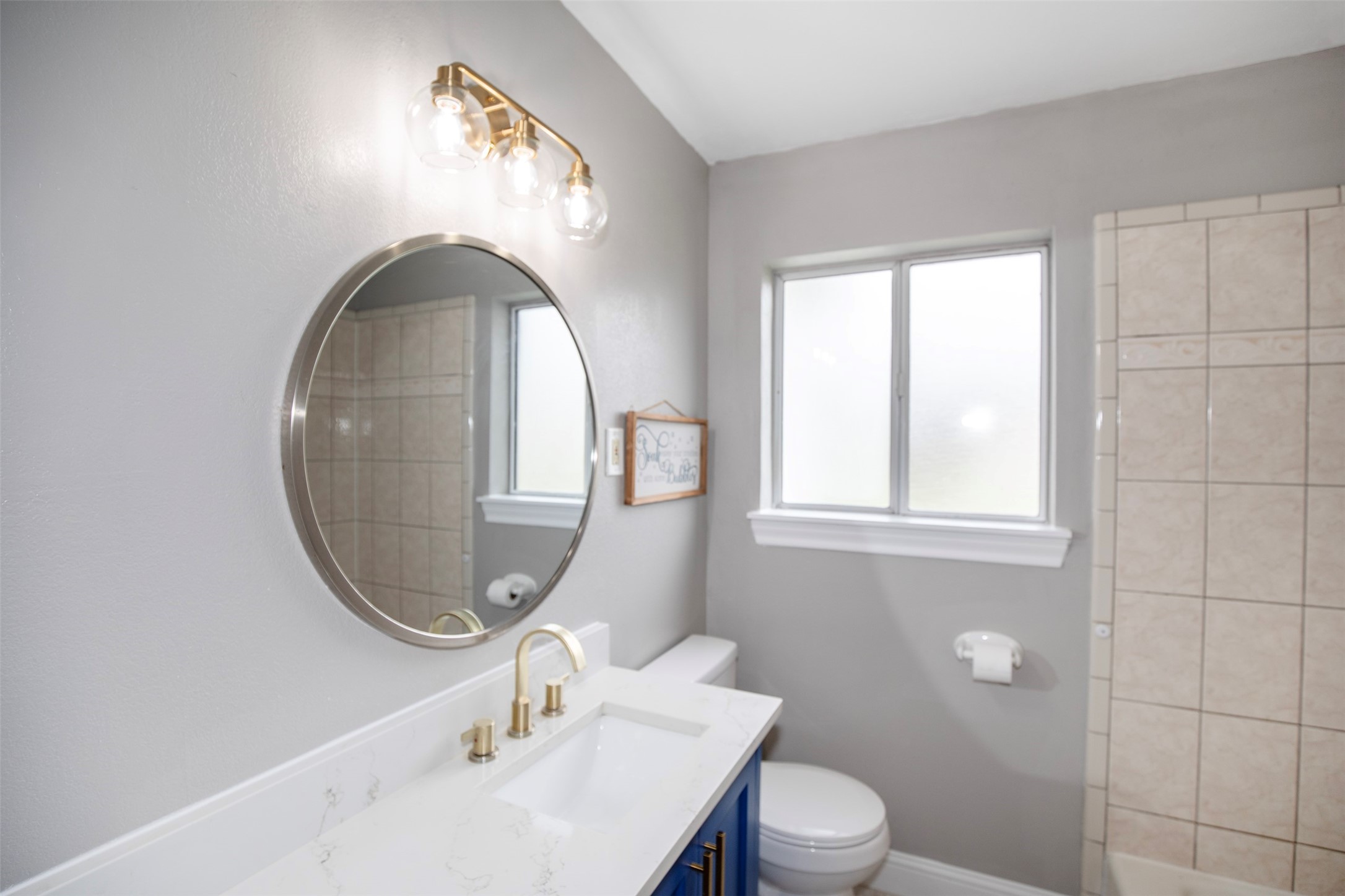 5535 Allendale Road Houston, TX 77017 - Photo 17 of 29 a bathroom with a sink a toilet and a mirror