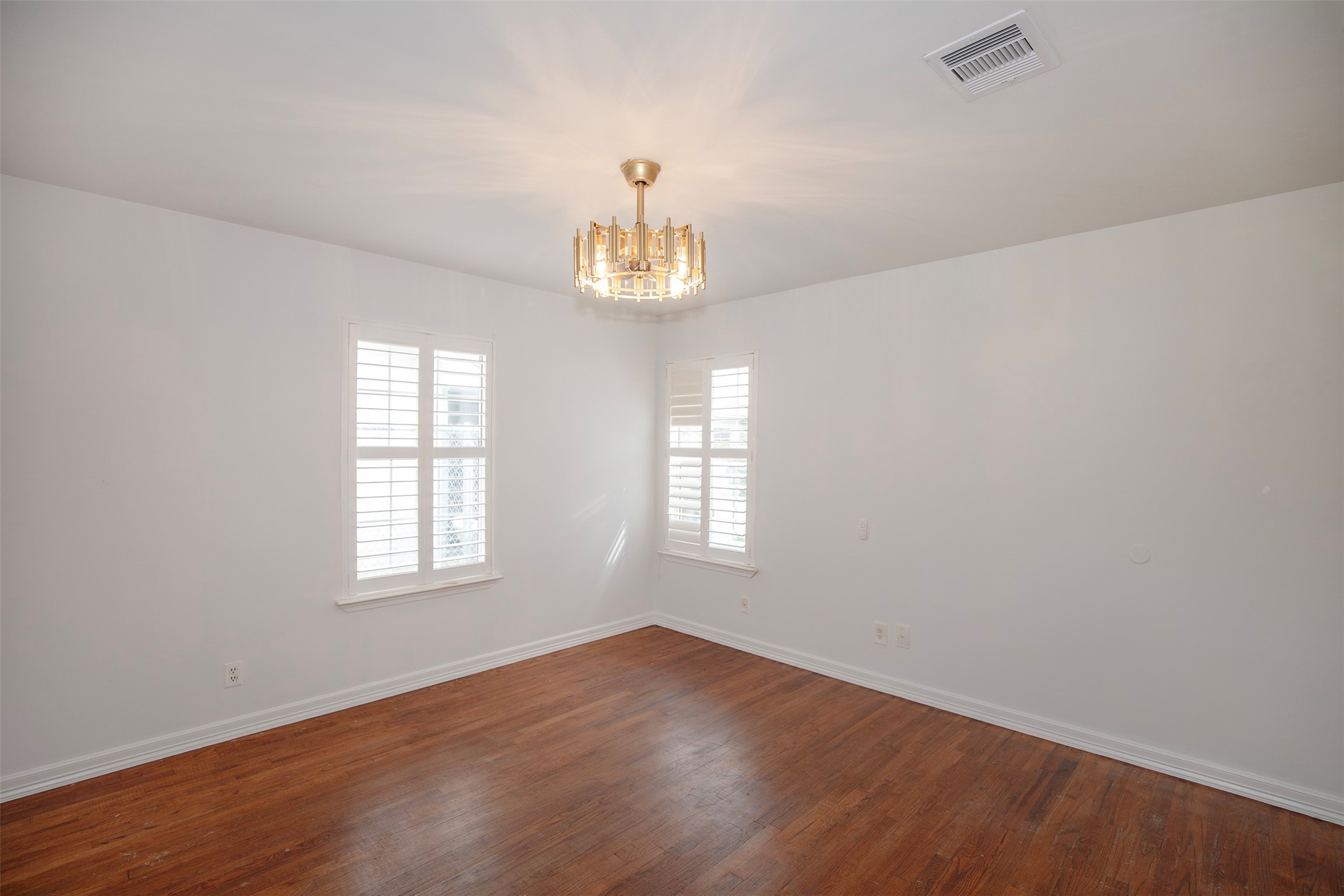 5535 Allendale Road Houston, TX 77017 - Photo 21 of 29 an empty room with wooden floor and windows